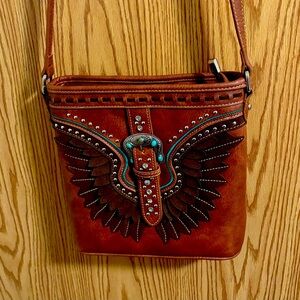 Artisan Brown Crossbody Bag with Wing Accents